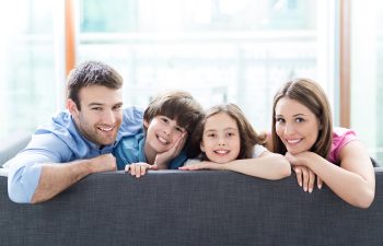 Family relaxing on sofa