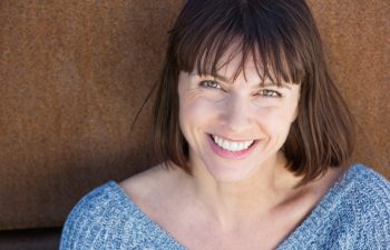 Close up portrait of a smiling middle aged woman